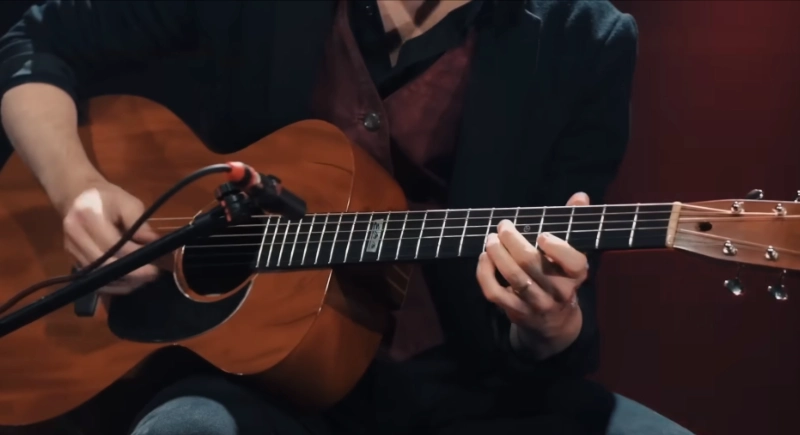 Eric Herman Endres performing with guitar for children's audience